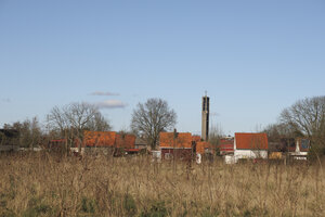 Charming village landscape of Moerdijk with red-roofed houses un