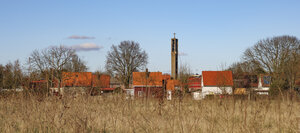 Moerdijk village landscape with a prominent church steeple and t