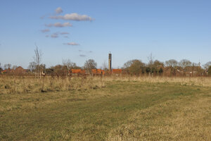 View of the peaceful landscape in Moerdijk featuring distant bui
