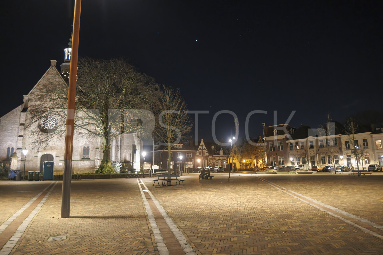 Vibrant night in Zevenbergen showcasing historic architecture an