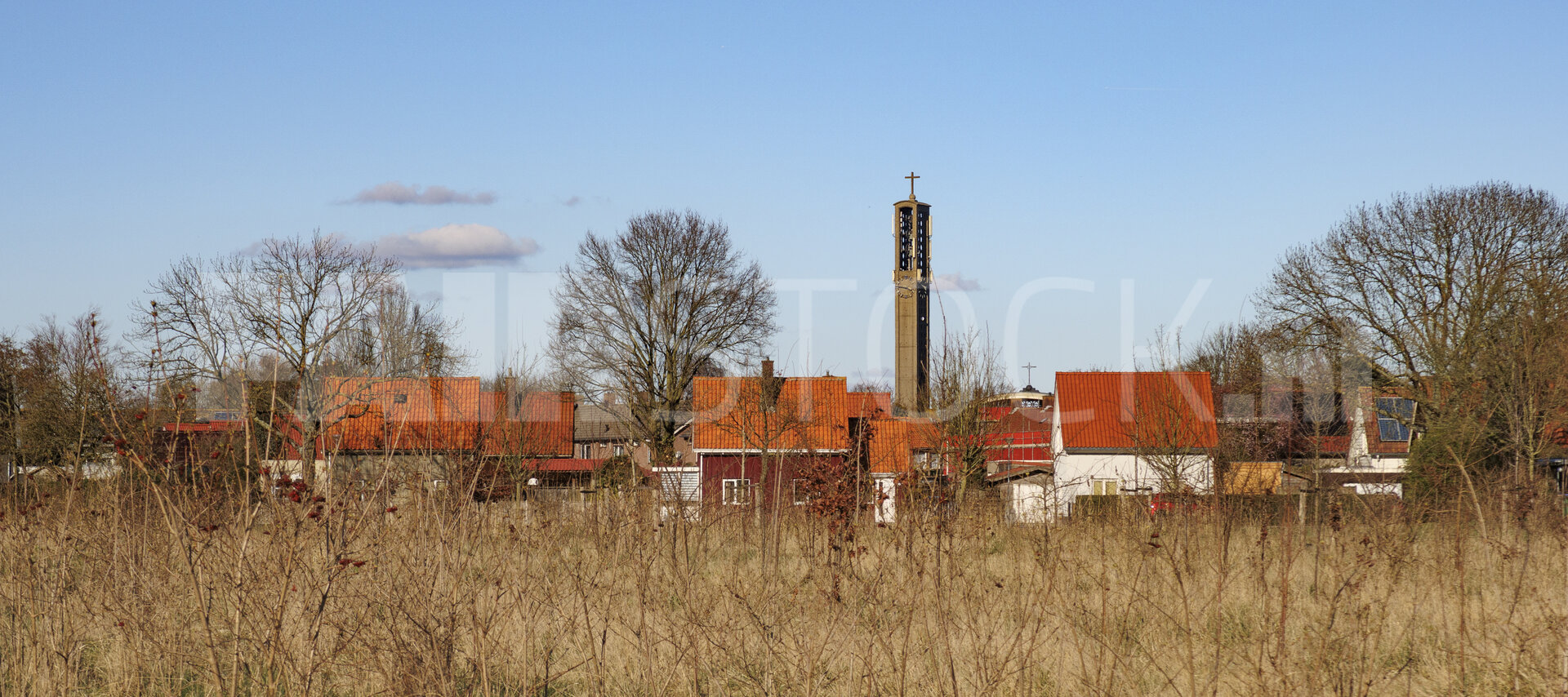 Moerdijk village landscape with a prominent church steeple and t